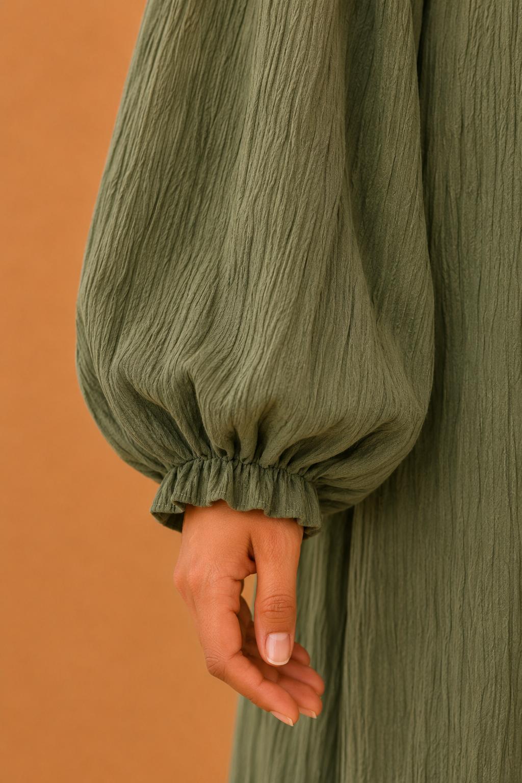 Blusas plisadas asimétricas