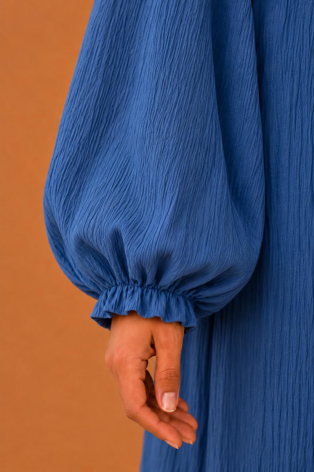 Blusas plisadas asimétricas