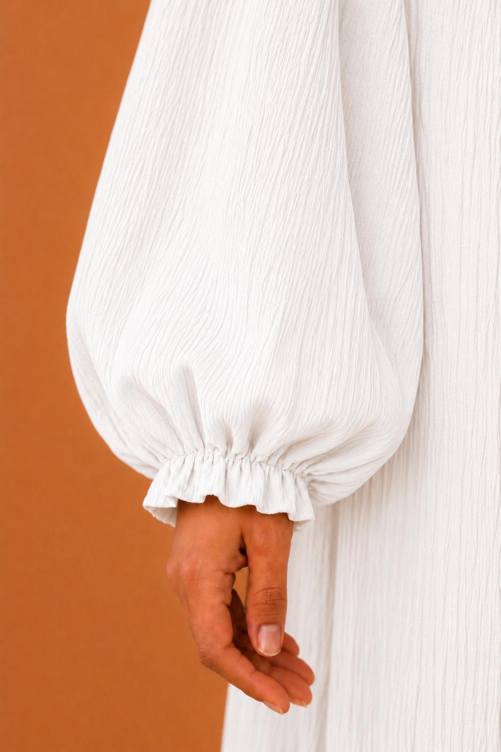 Blusas plisadas asimétricas